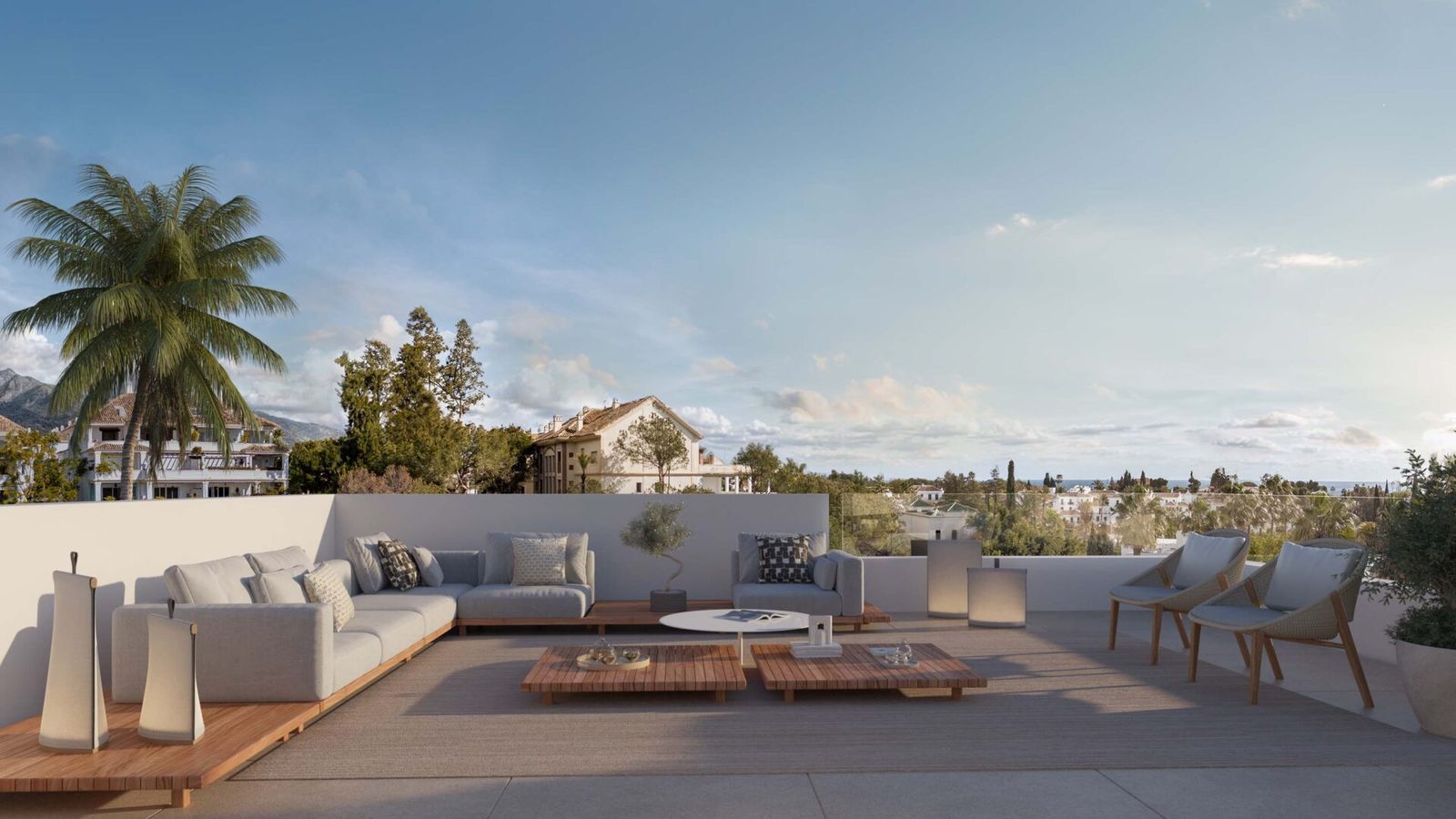 Terrasse ensoleillée Noura Villas avec mobilier de salon et vue.